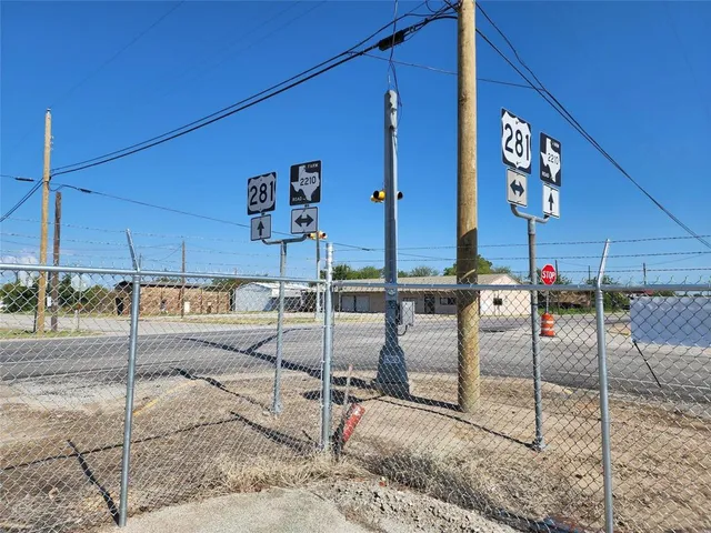 a view of a street with sitting area