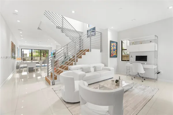 a living room with furniture and a table
