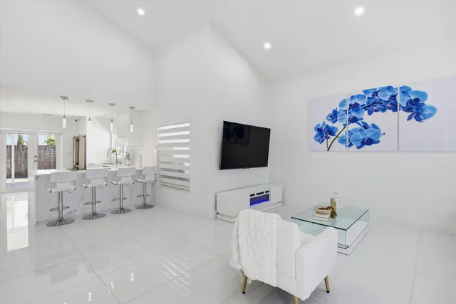 a bedroom with furniture and a flat screen tv