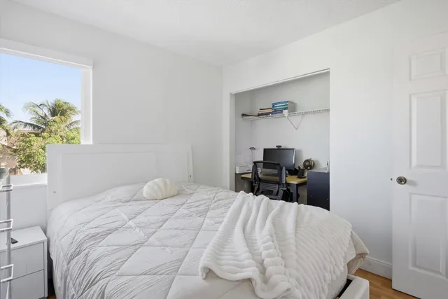 a bedroom with a bed and a chair