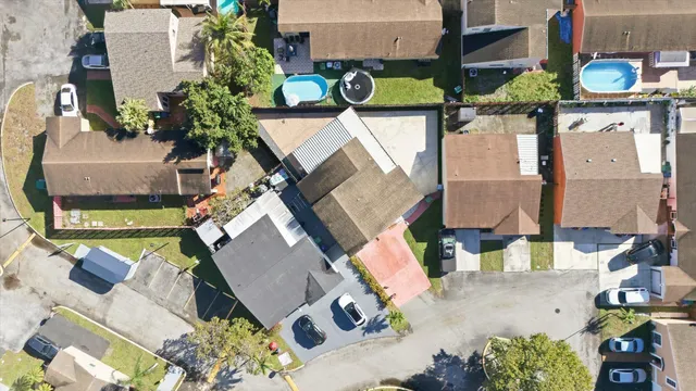 an aerial view of houses with outdoor space