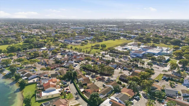 an aerial view of residential houses with city view