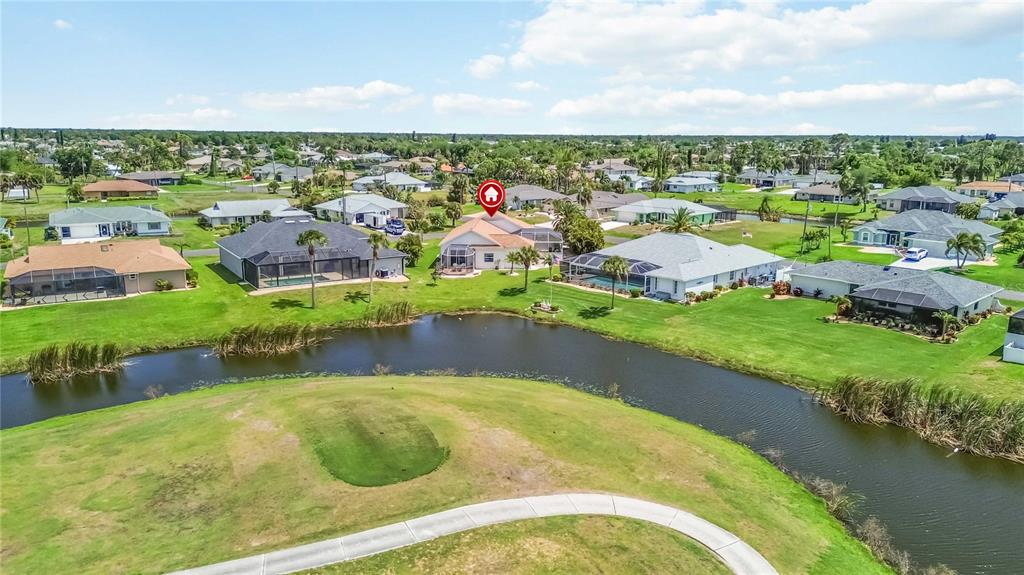48 Bunker Road Rotonda West, FL 33947 - Photo 59 of 59 a view of a lake with a city