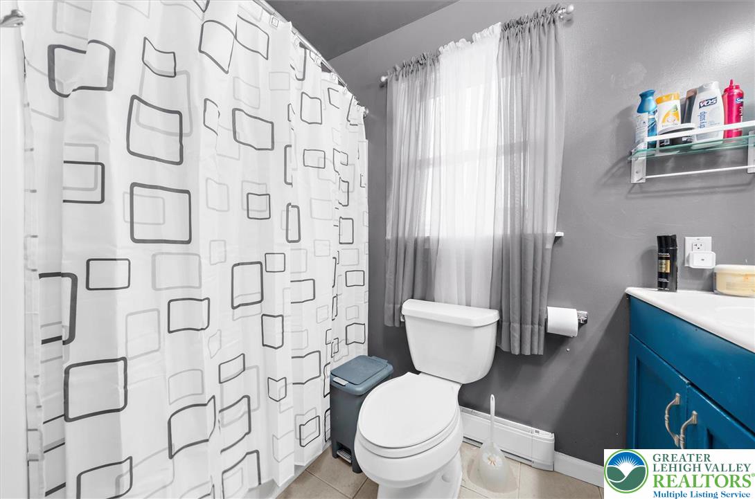 326 Chestnut Street Slatington, PA 18080 - Photo 18 of 28 a white toilet sitting next to a bathroom sink