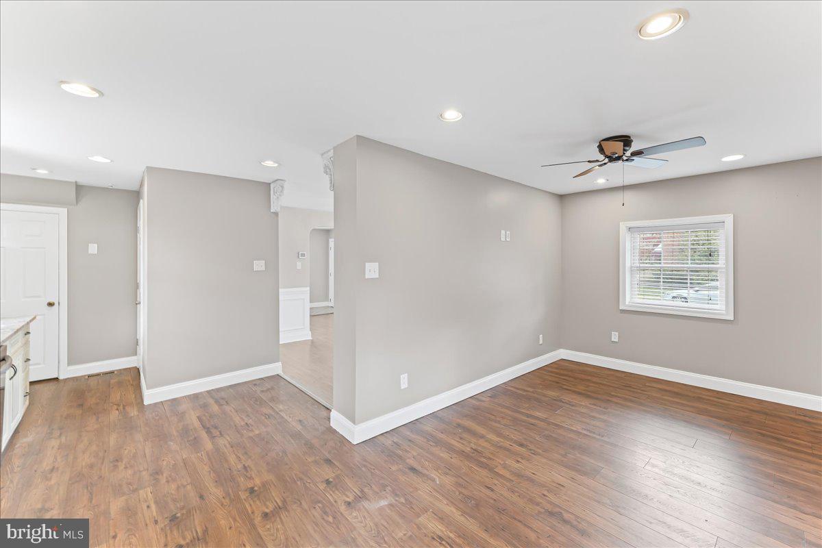 200 Fairview Road Springfield, PA 19064 - Photo 11 of 43 an empty room with wooden floor and windows