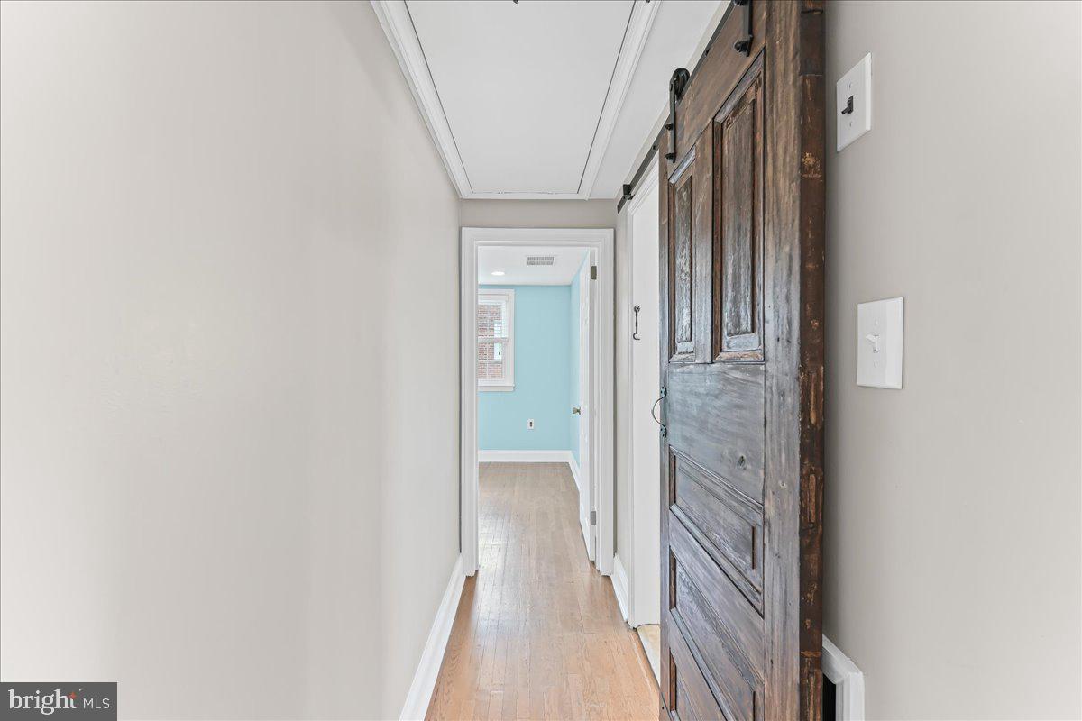 200 Fairview Road Springfield, PA 19064 - Photo 20 of 43 a view of a hallway with wooden floor and staircase