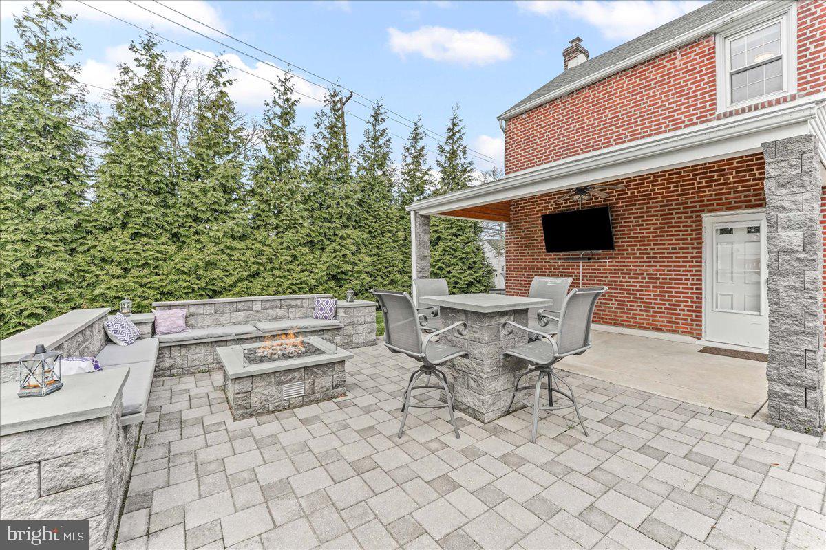 200 Fairview Road Springfield, PA 19064 - Photo 35 of 43 a roof deck with table and chairs and potted plants