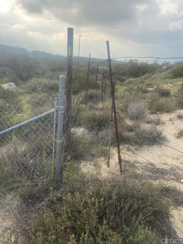 a fire hydrant in the middle of a field