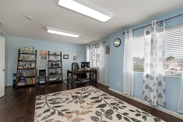 a bedroom with furniture and a window