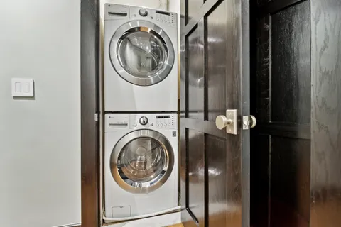 a view of a hallway with washer and dryer