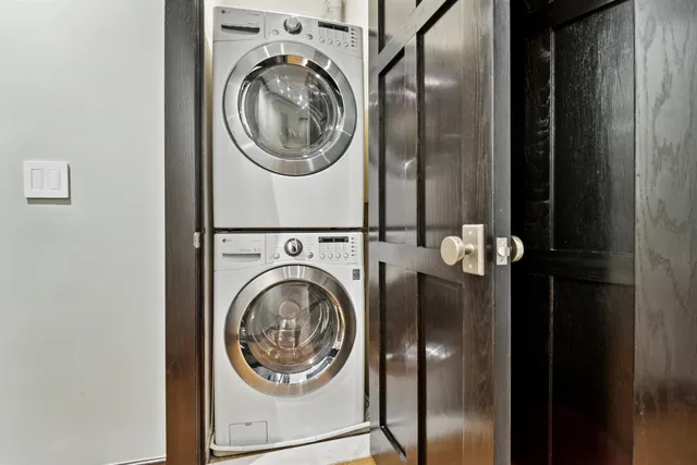 a view of a hallway with washer and dryer