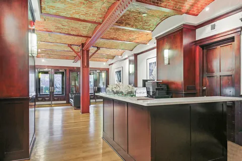 a kitchen with counter top space and windows