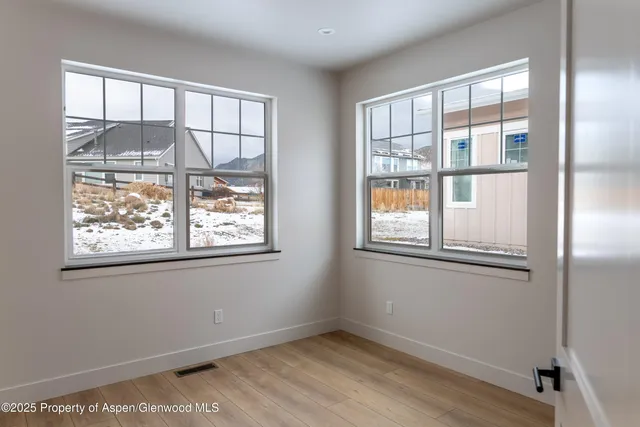 a view of empty room with windows