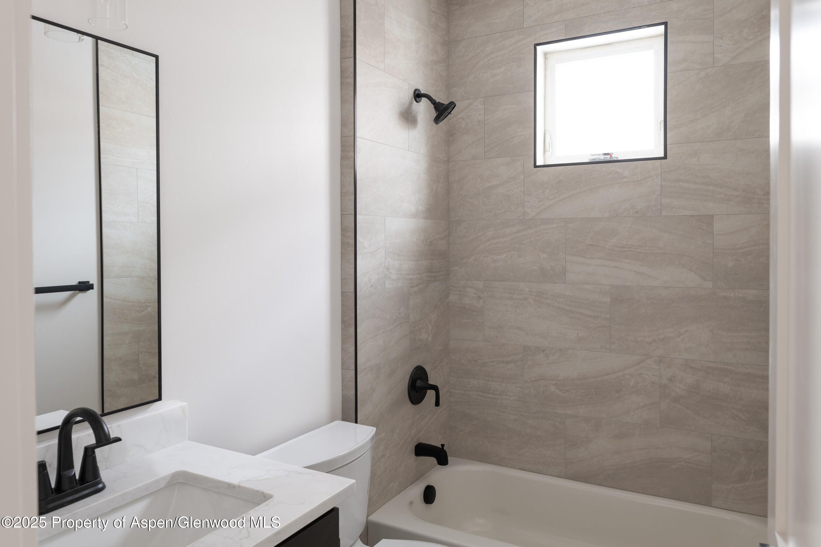 42 Mount Yale Court New Castle, CO 81647 - Photo 15 of 26 a bathroom with a bathtub and a shower