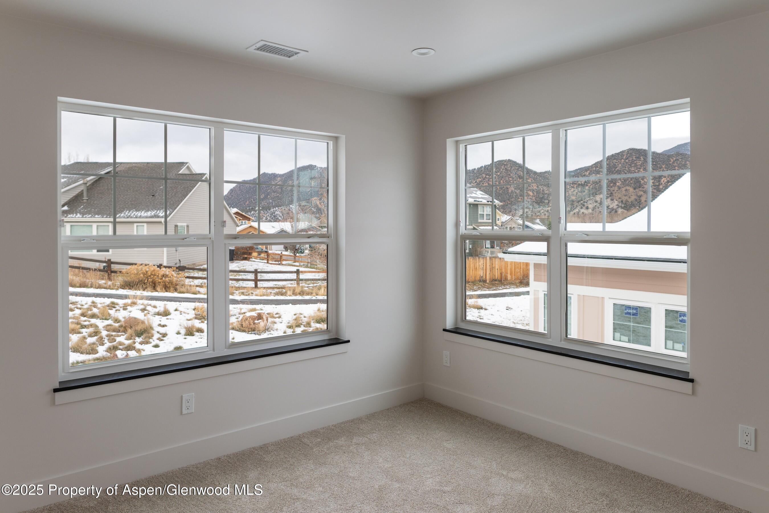 42 Mount Yale Court New Castle, CO 81647 - Photo 16 of 26 a view of empty room with windows