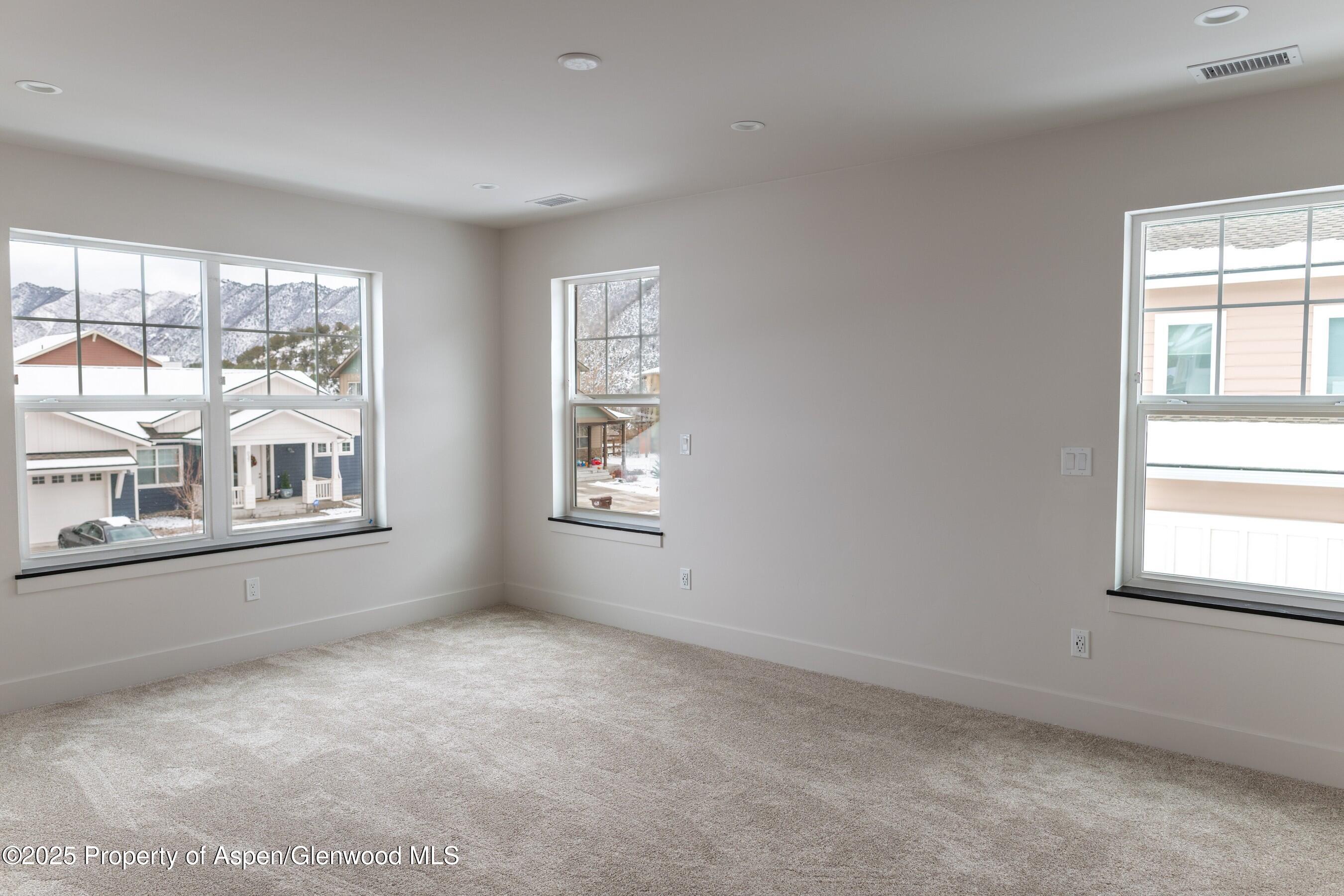 42 Mount Yale Court New Castle, CO 81647 - Photo 21 of 26 an empty room with windows