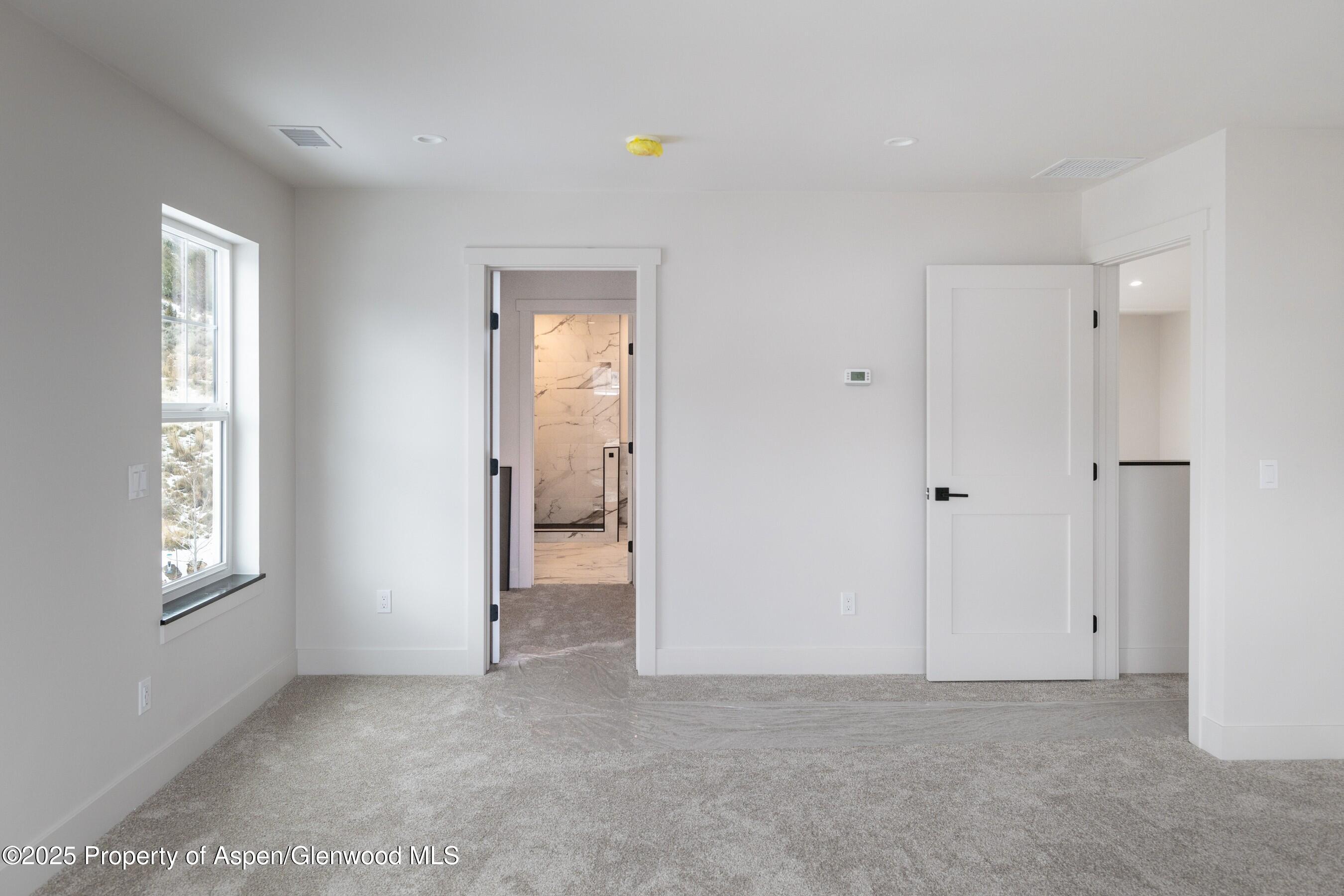 42 Mount Yale Court New Castle, CO 81647 - Photo 22 of 26 a view of an empty room and window