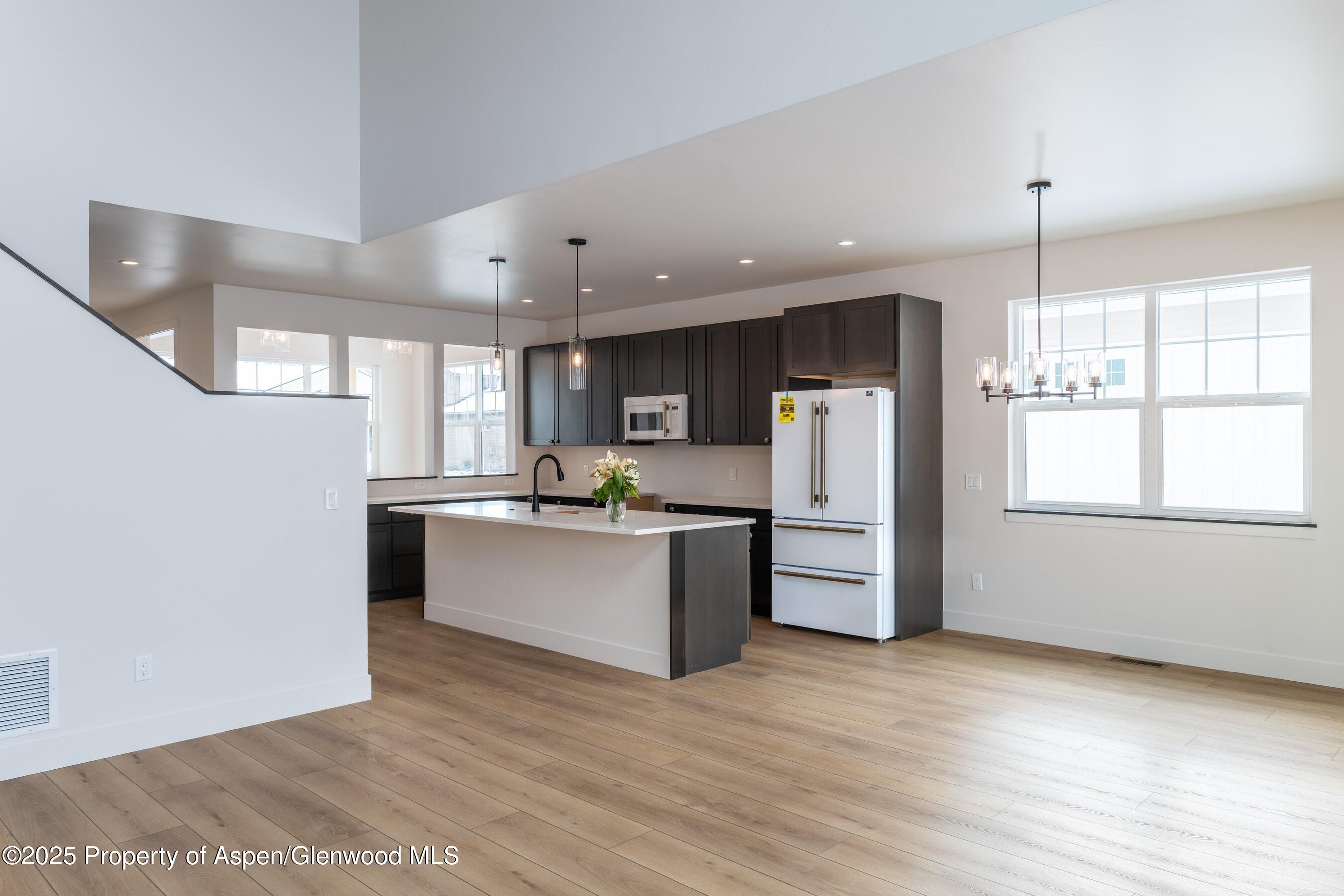 42 Mount Yale Court New Castle, CO 81647 - Photo 8 of 26 a kitchen with refrigerator and window