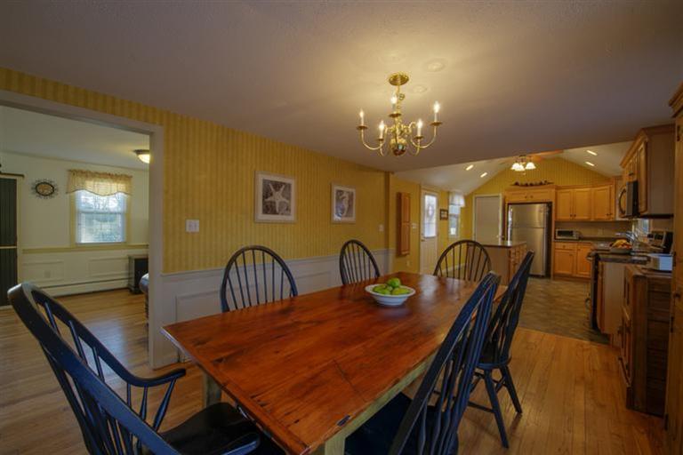 10 Goose Point Road Centerville, MA 02601 - Photo 11 of 30 a dining room with furniture and chandelier