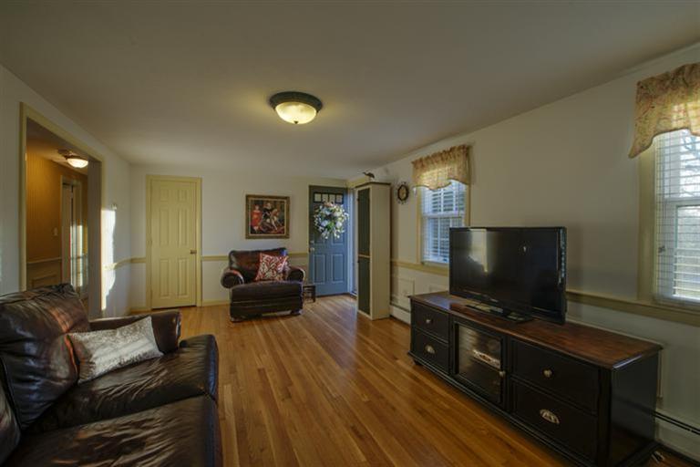 10 Goose Point Road Centerville, MA 02601 - Photo 13 of 30 a living room with furniture and a flat screen tv