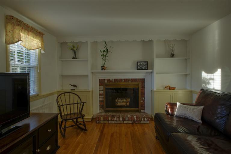 10 Goose Point Road Centerville, MA 02601 - Photo 14 of 30 a living room with furniture and a fireplace