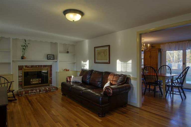 10 Goose Point Road Centerville, MA 02601 - Photo 16 of 30 a living room with furniture and a fireplace