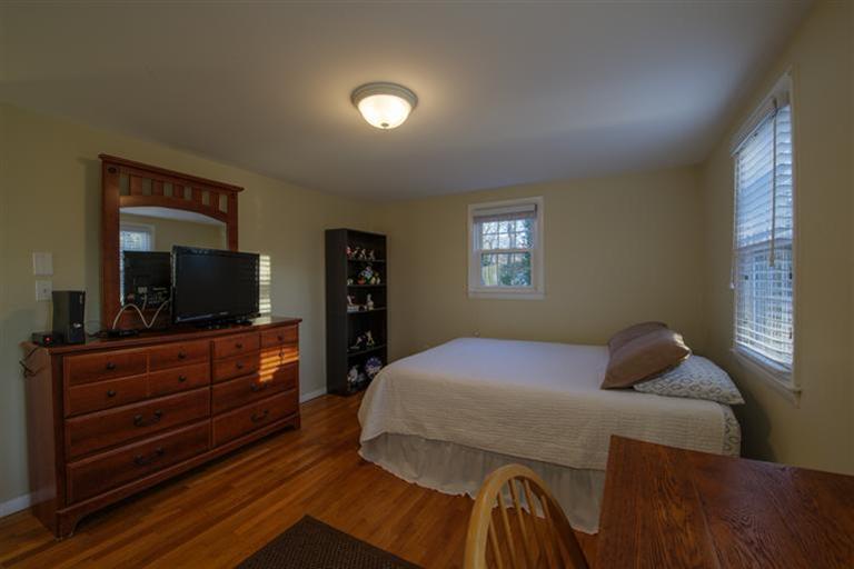10 Goose Point Road Centerville, MA 02601 - Photo 18 of 30 a bedroom with a bed and flat screen tv