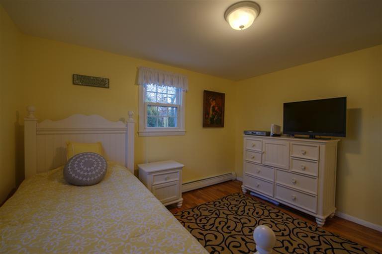 10 Goose Point Road Centerville, MA 02601 - Photo 21 of 30 a room with furniture and a flat screen tv