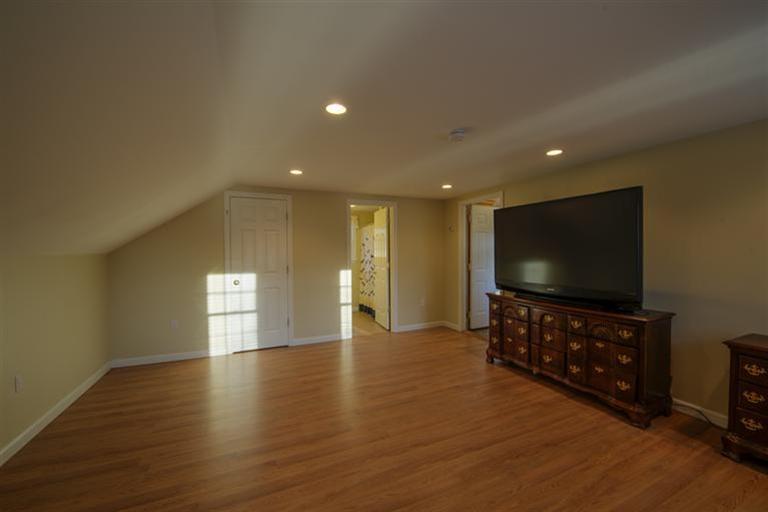 10 Goose Point Road Centerville, MA 02601 - Photo 25 of 30 a living room with furniture and a flat screen tv