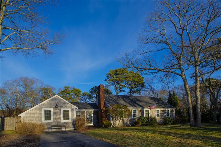 10 Goose Point Road Centerville, MA 02601 - Photo 3 of 30 a view of a big house with a big yard and large trees