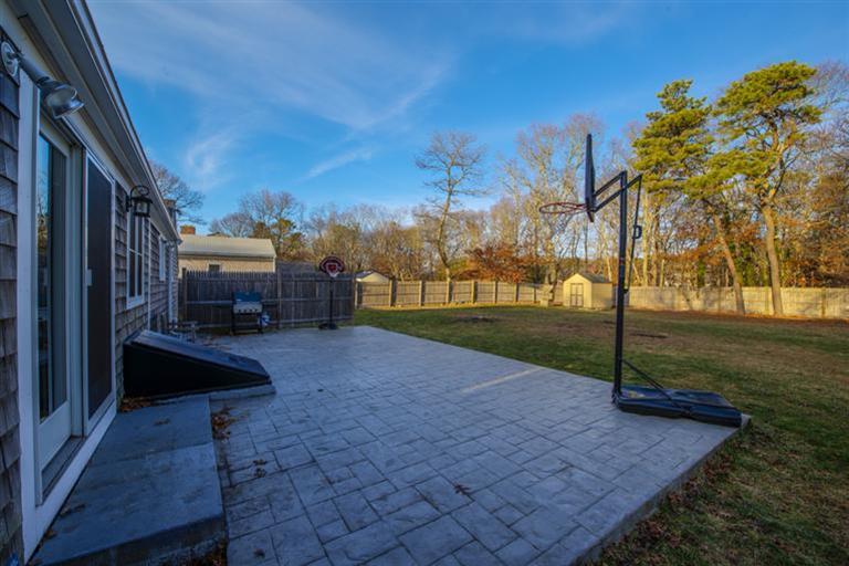 10 Goose Point Road Centerville, MA 02601 - Photo 4 of 30 a view of backyard with green space