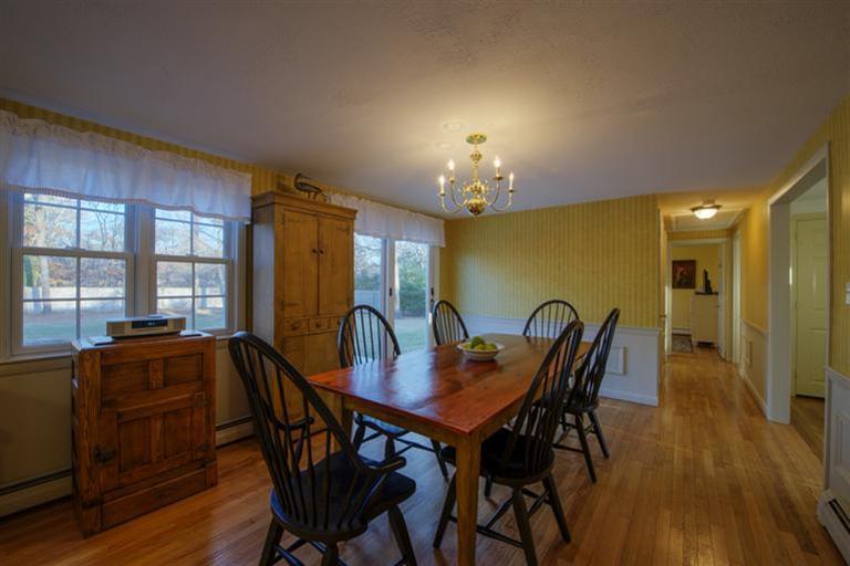 10 Goose Point Road Centerville, MA 02601 - Photo 10 of 30 a view of a dining room with furniture window and wooden floor