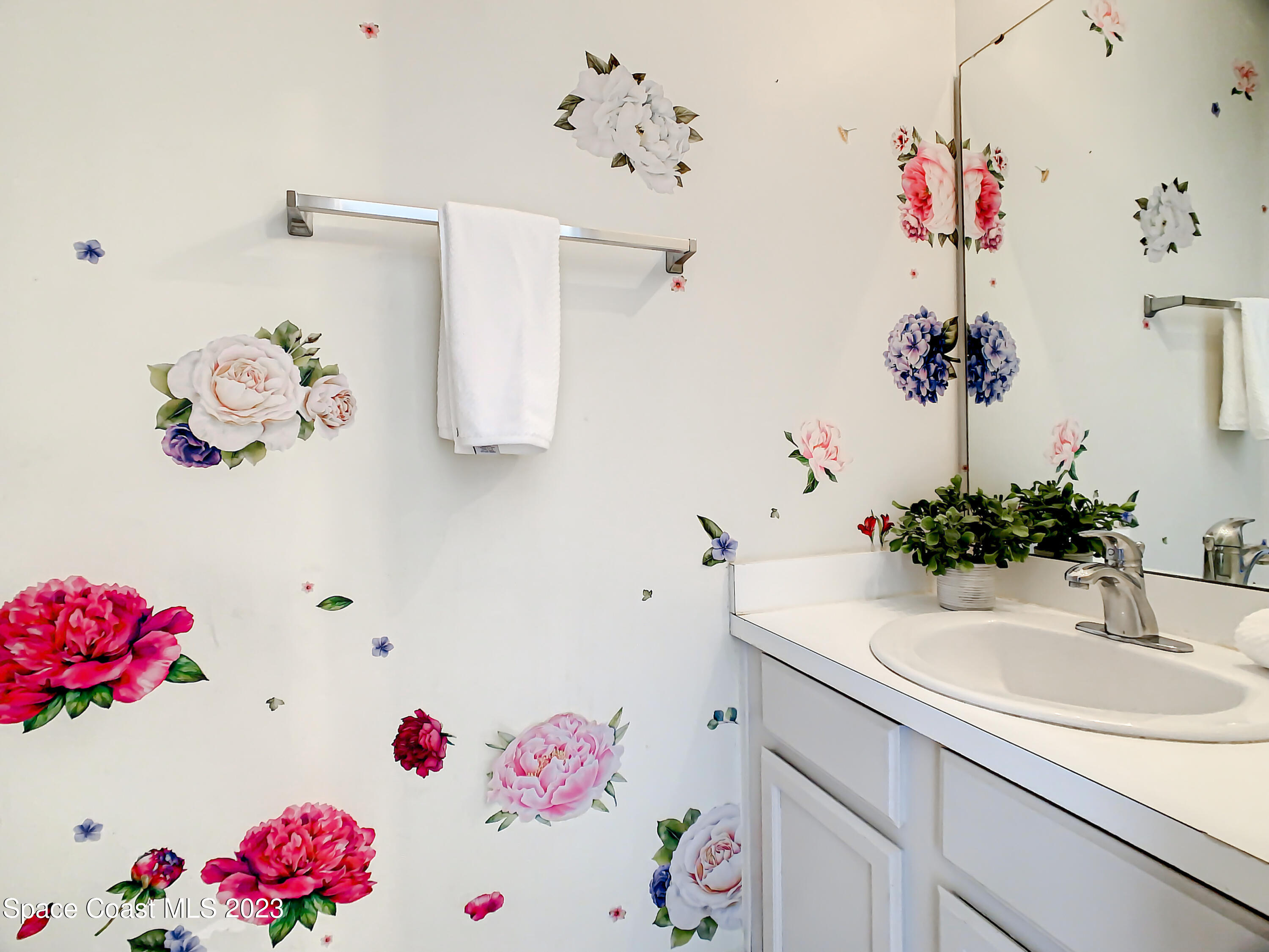4859 Sisson Road Titusville, FL 32780 - Photo 11 of 30 a bathroom with a sink a bath tub and a sink