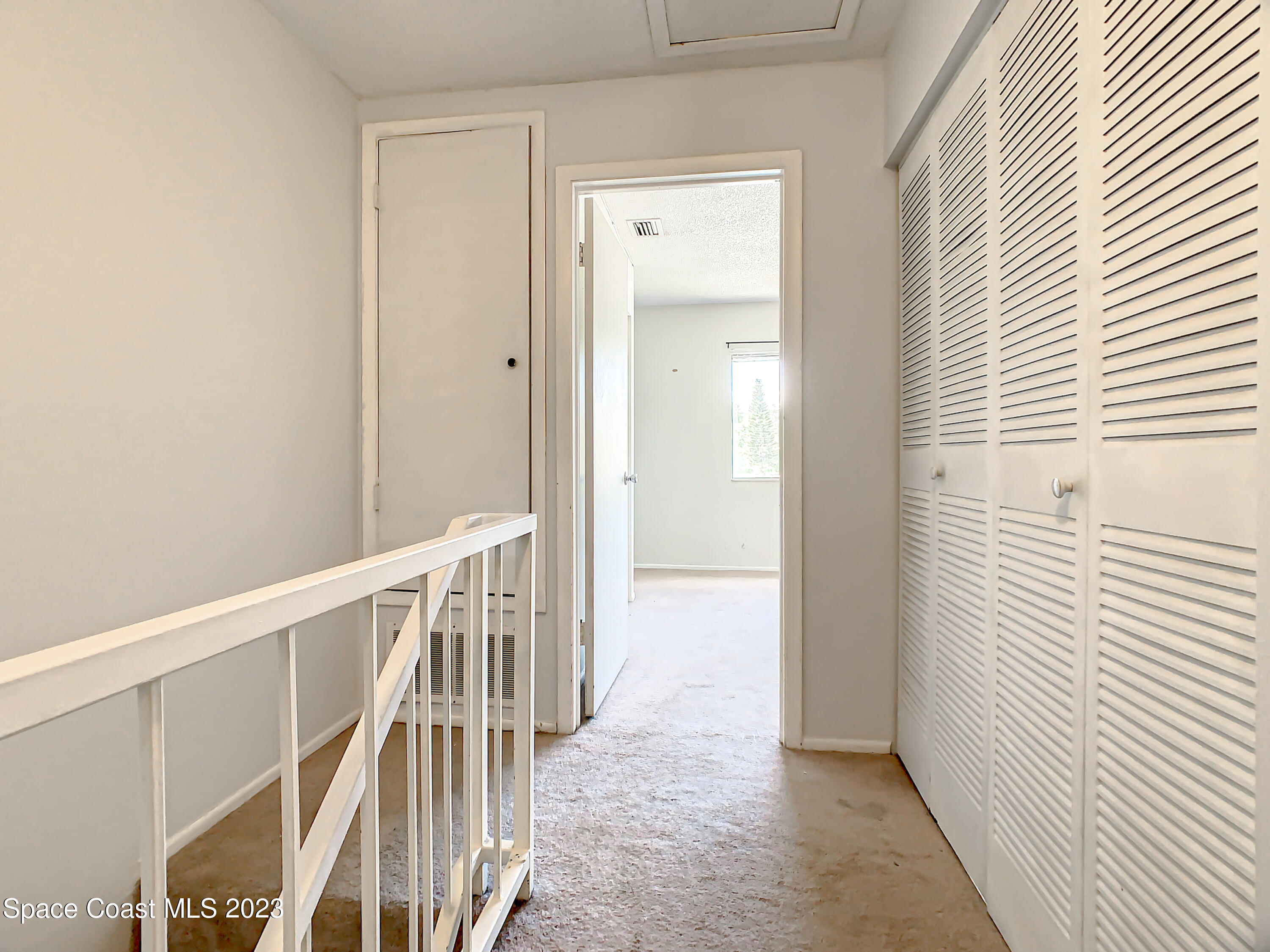 4859 Sisson Road Titusville, FL 32780 - Photo 17 of 30 a view of a hallway with wooden floor and entryway