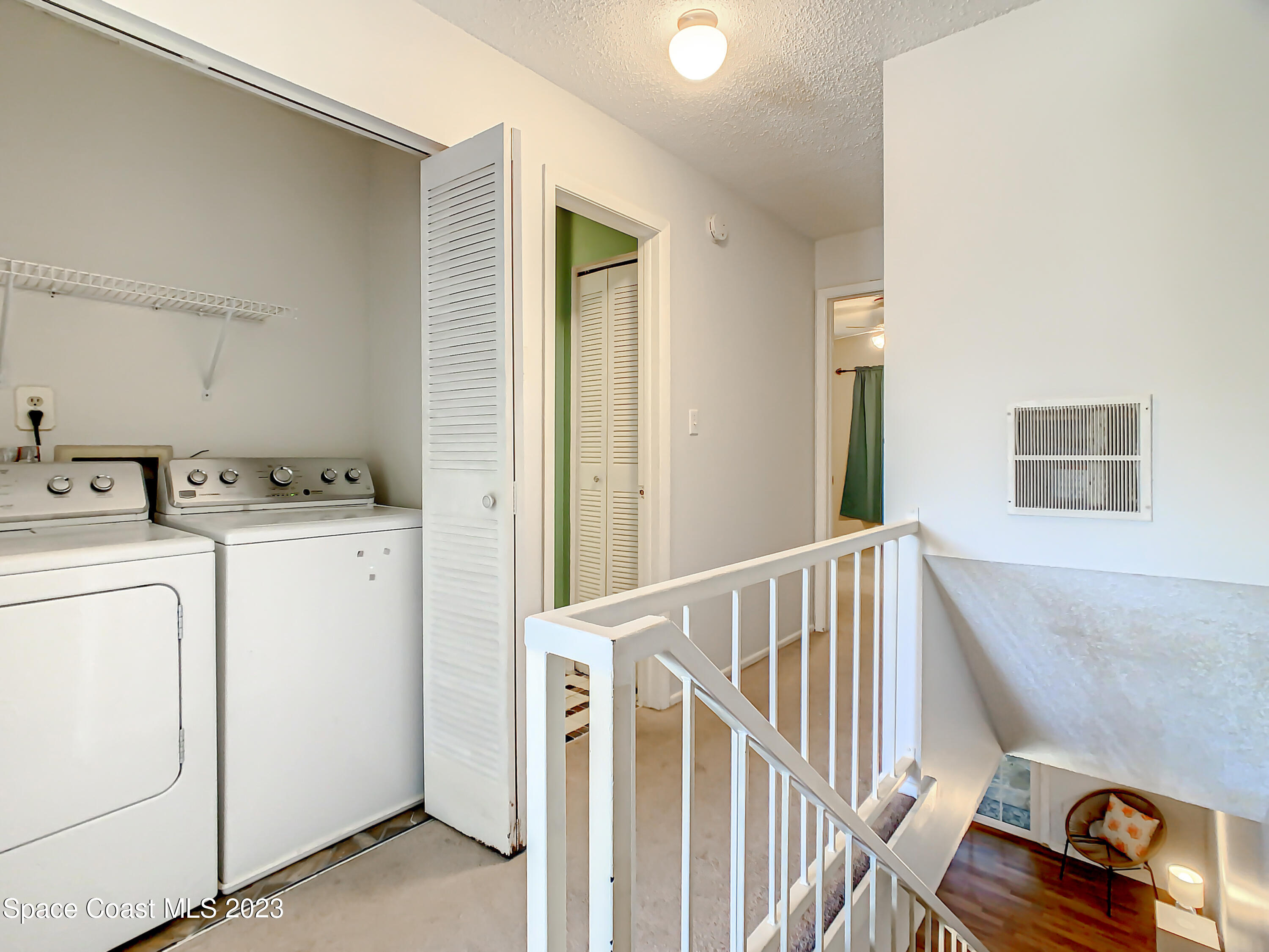 4859 Sisson Road Titusville, FL 32780 - Photo 18 of 30 a utility room with dryer and washer