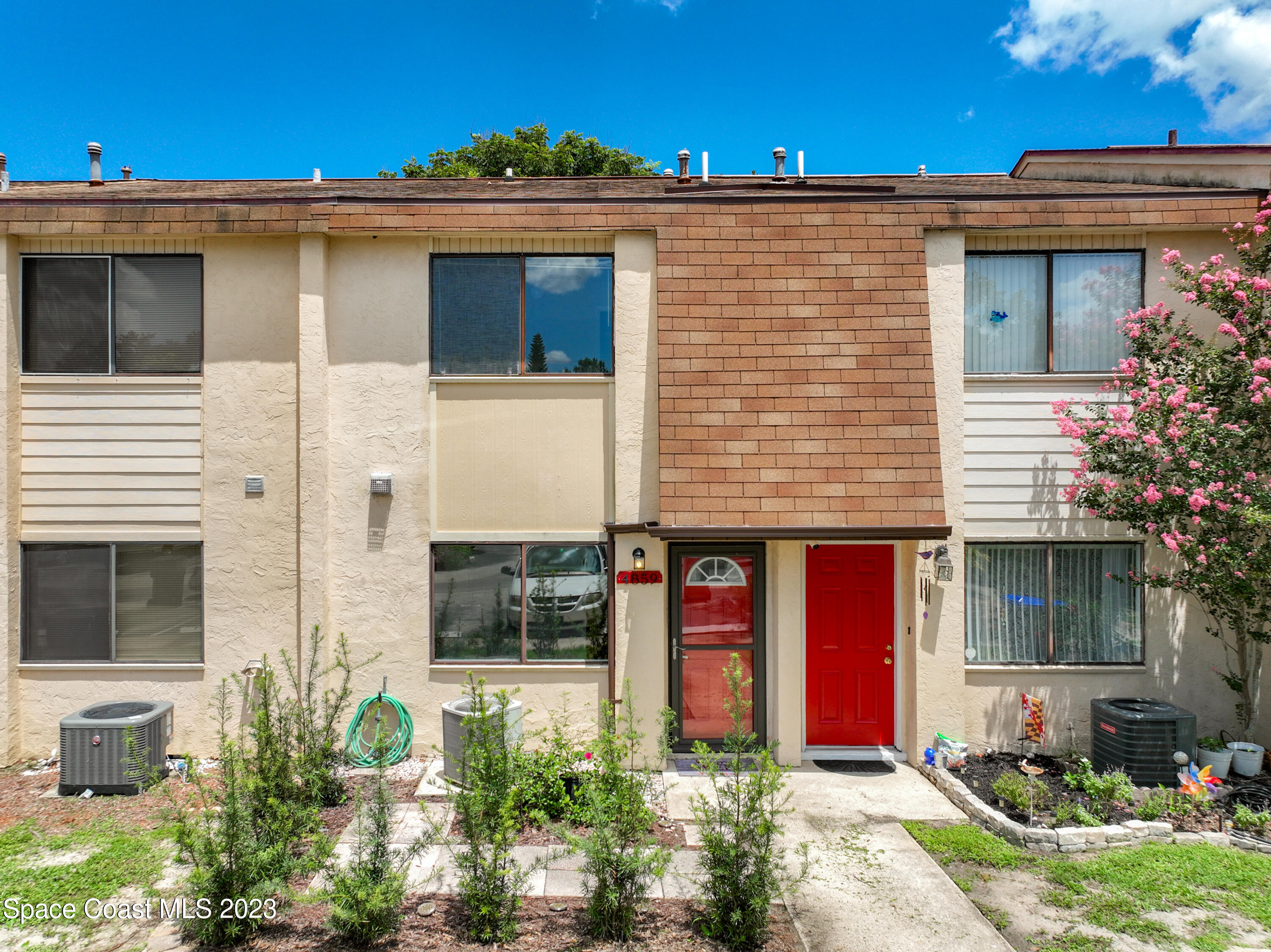 4859 Sisson Road Titusville, FL 32780 - Photo 2 of 30 a front view of a house with garden