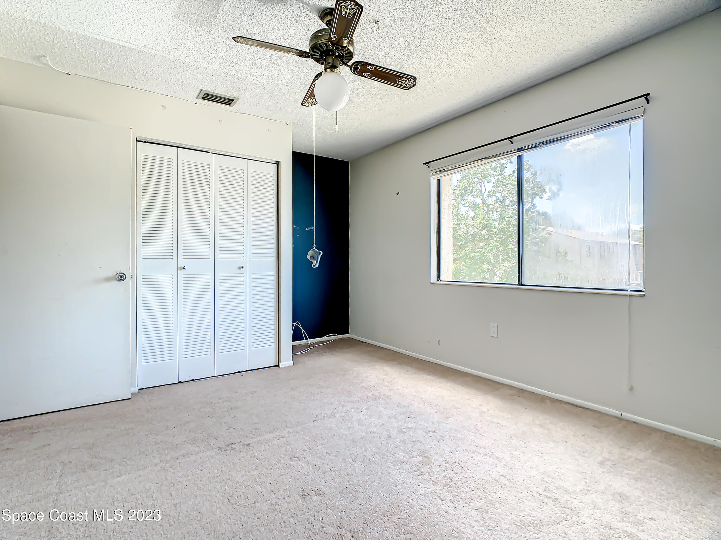 4859 Sisson Road Titusville, FL 32780 - Photo 24 of 30 a view of an empty room with a window