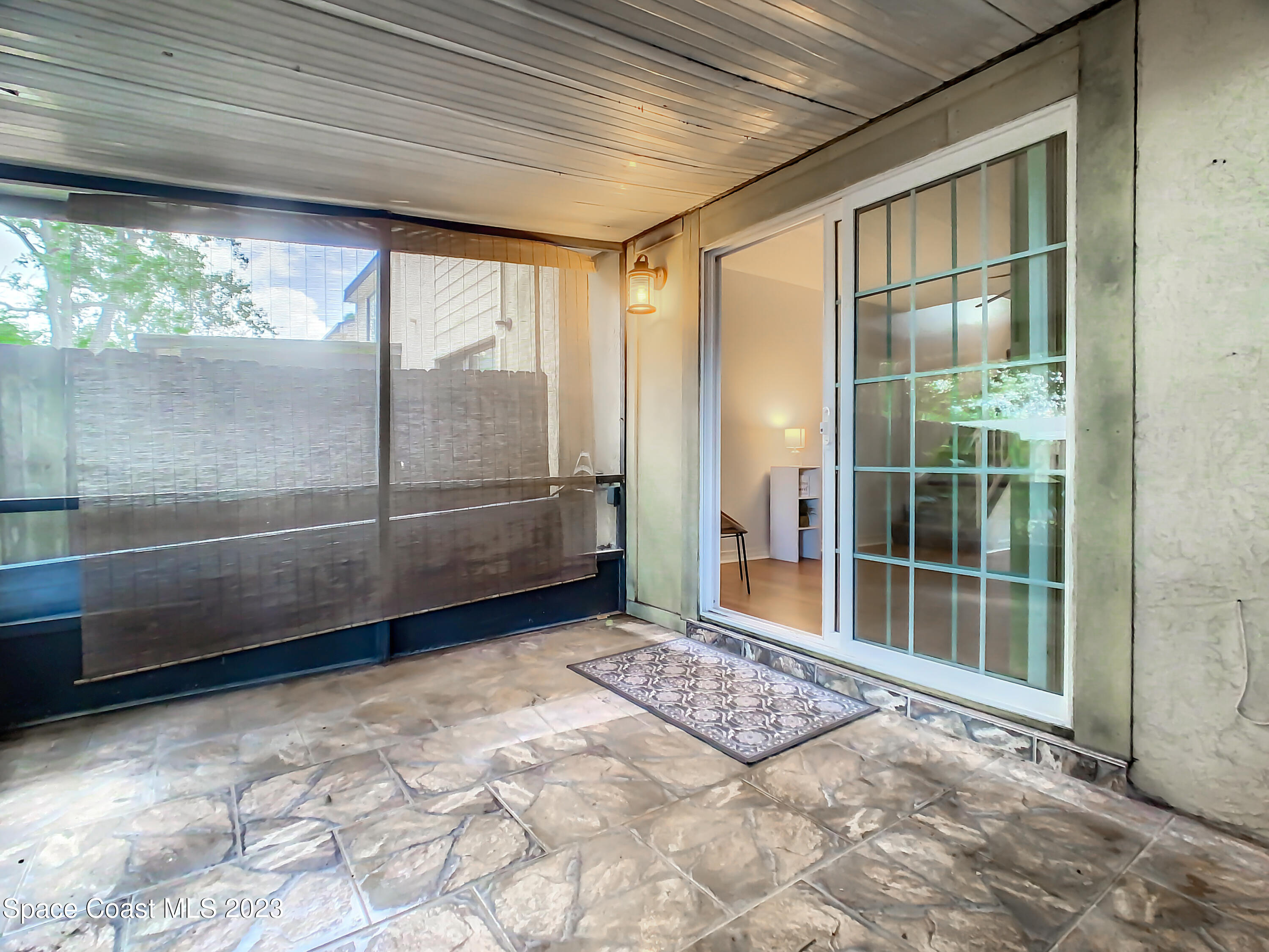 4859 Sisson Road Titusville, FL 32780 - Photo 25 of 30 a view of an empty room with a large window