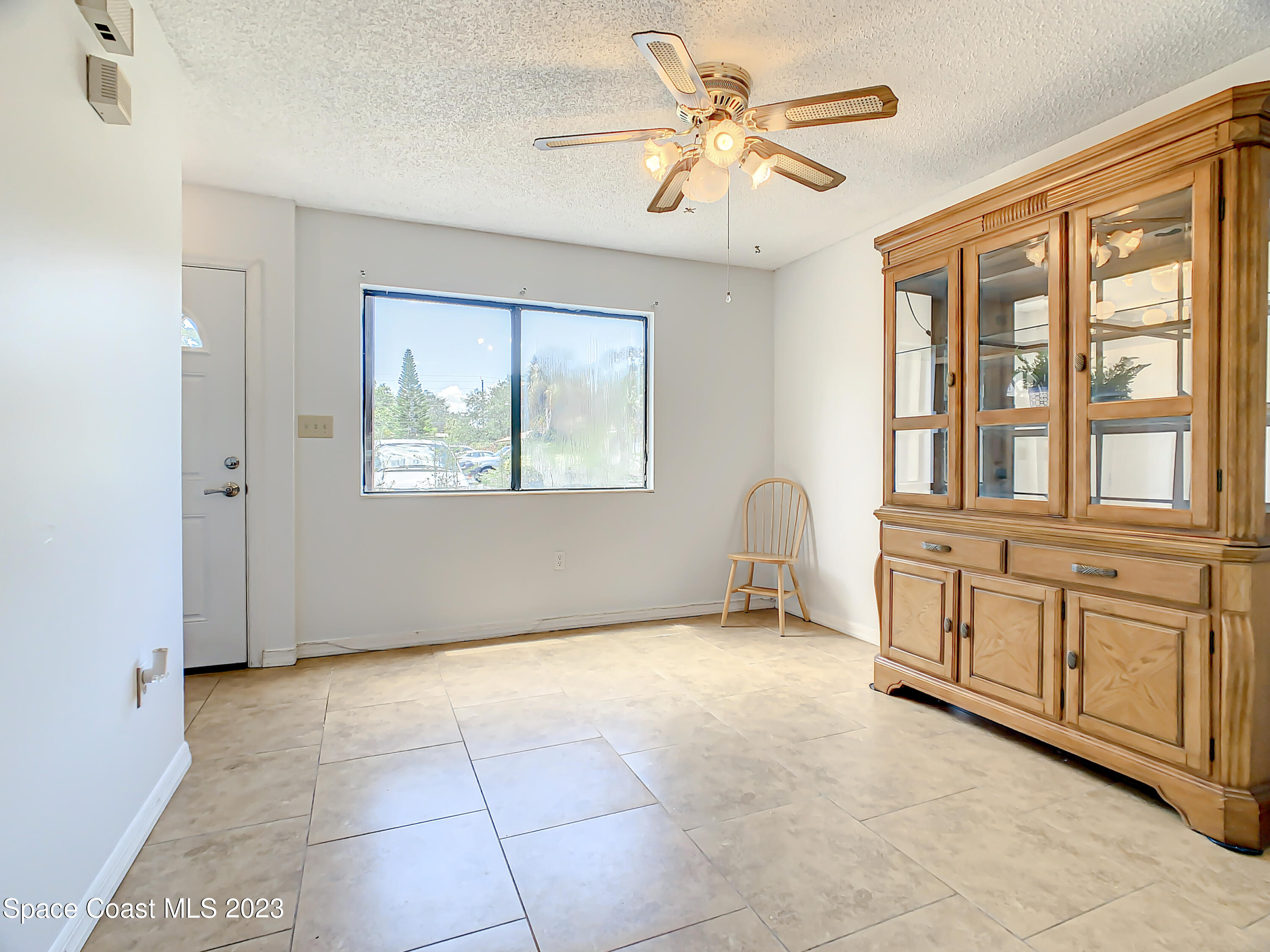 4859 Sisson Road Titusville, FL 32780 - Photo 3 of 30 a view of an empty room with a window