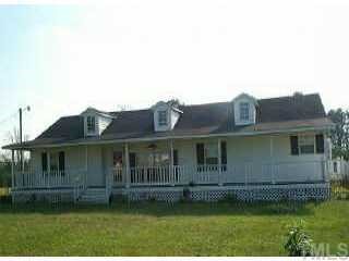 628 Noah Road Benson, NC 27504 - Photo 1 of 1 a view of a house with a garden