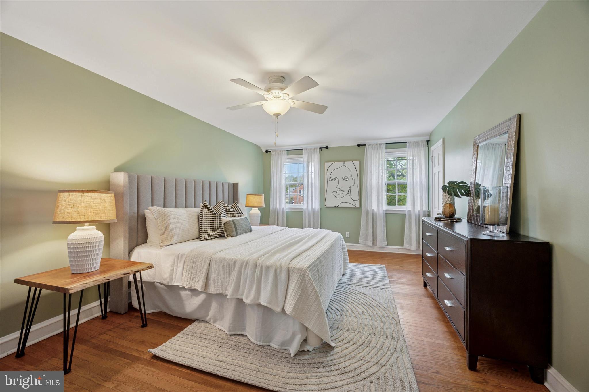 1612 Earlington Road Havertown, PA 19083 - Photo 15 of 35 a bedroom with a large bed and a chandelier