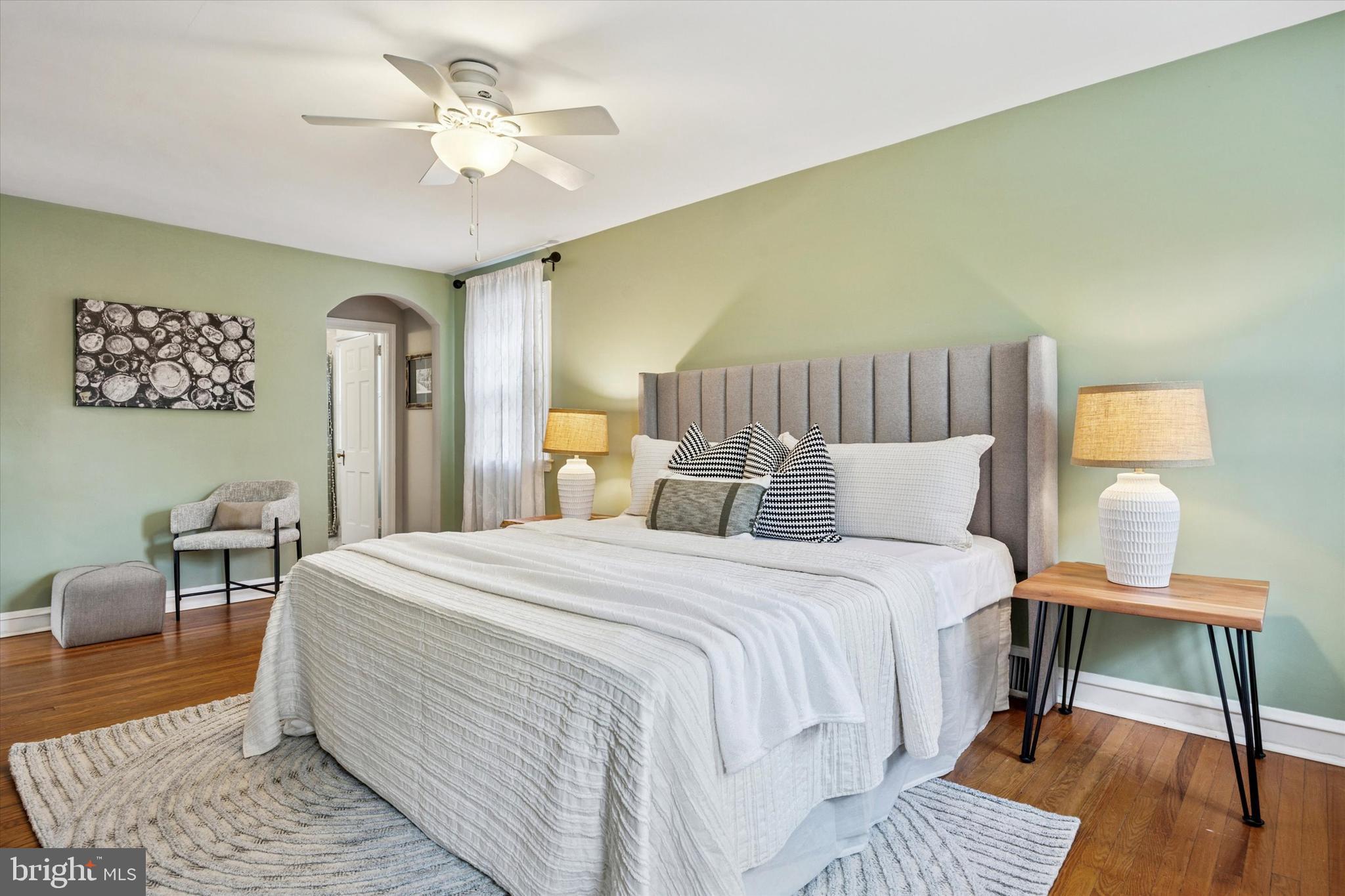 1612 Earlington Road Havertown, PA 19083 - Photo 17 of 35 a bedroom with a bed and a chandelier