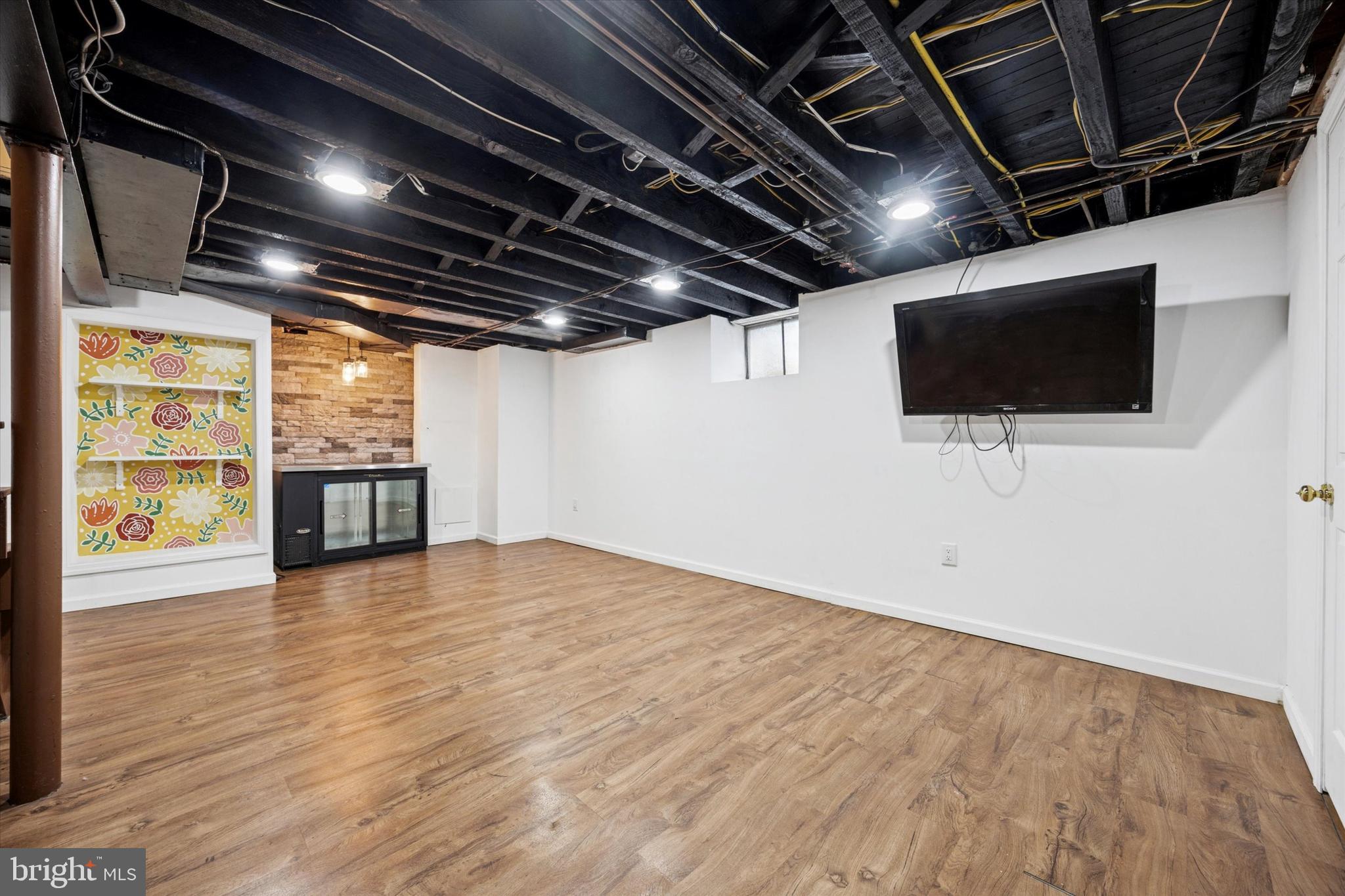 1612 Earlington Road Havertown, PA 19083 - Photo 28 of 35 a view of a livingroom with wooden floor and a flat screen tv