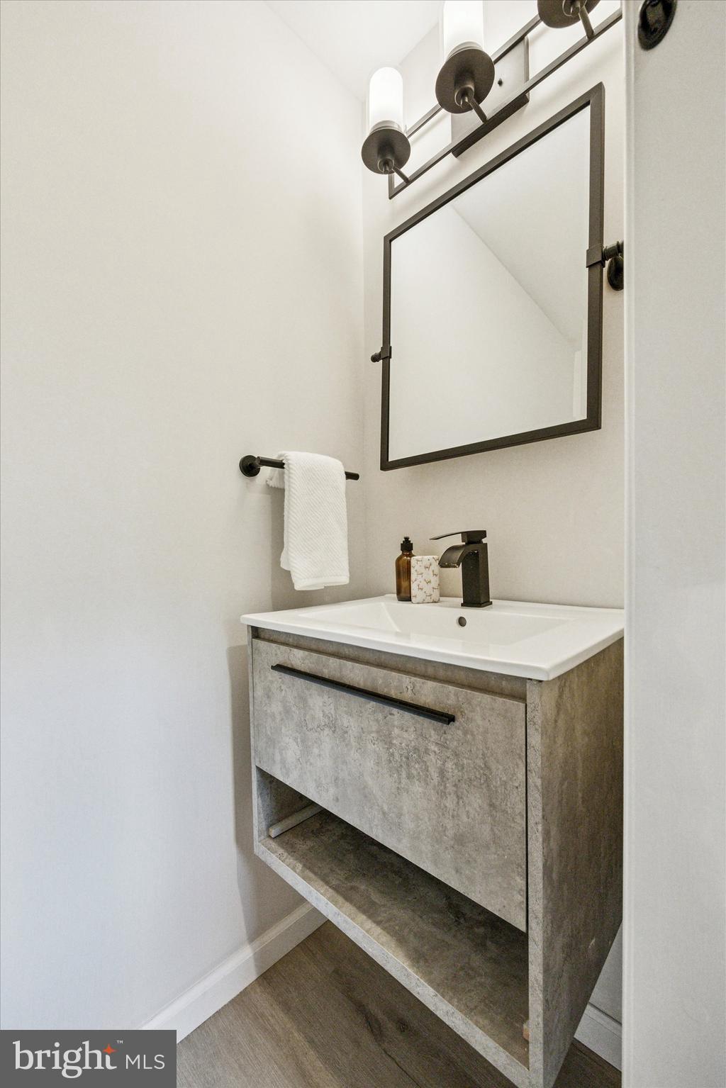 1612 Earlington Road Havertown, PA 19083 - Photo 10 of 35 a bathroom with a sink vanity and mirror