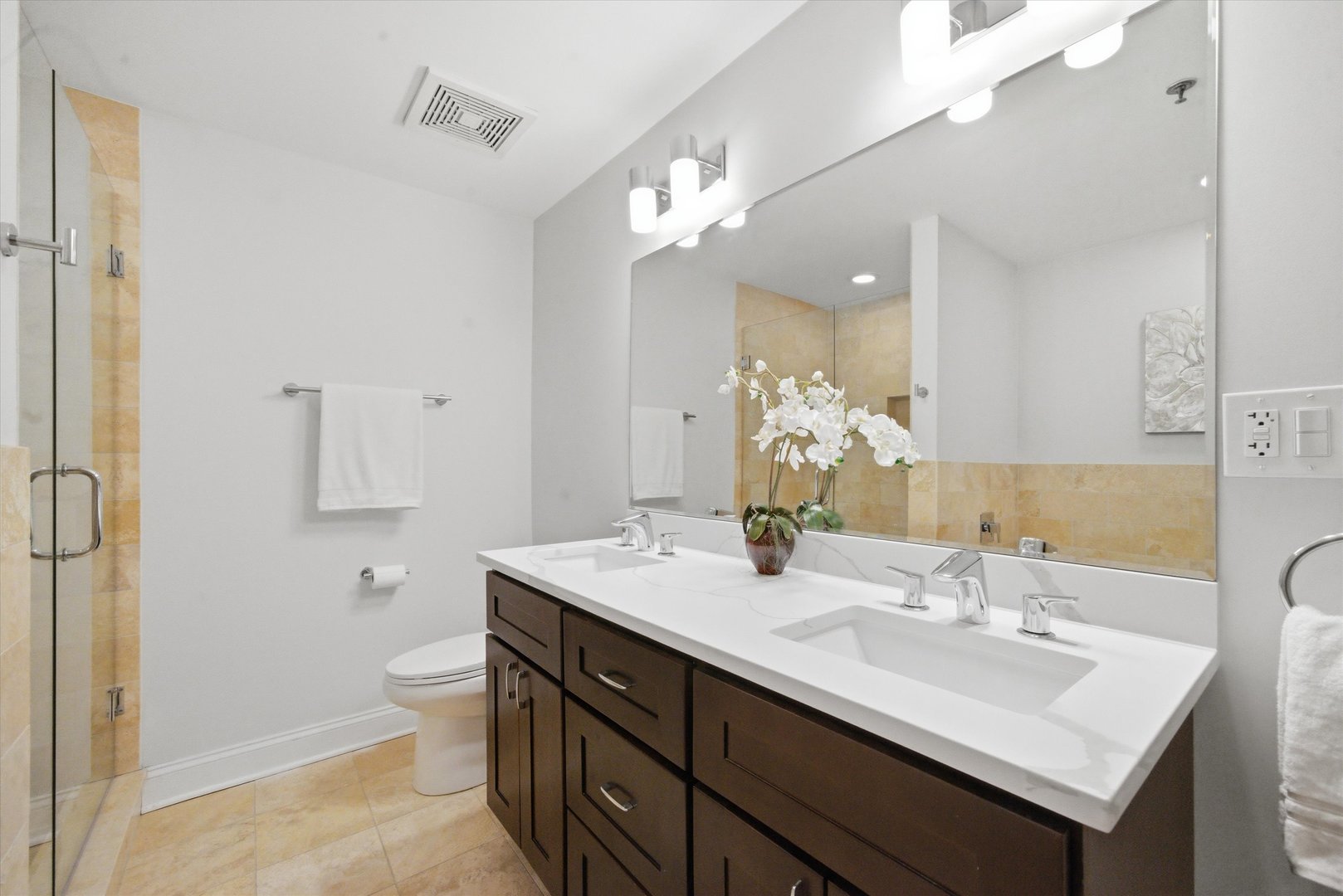 1610 South Halsted Street, Unit 401 Chicago, IL 60608 - Photo 12 of 31 a bathroom with a sink a toilet a large mirror and shower