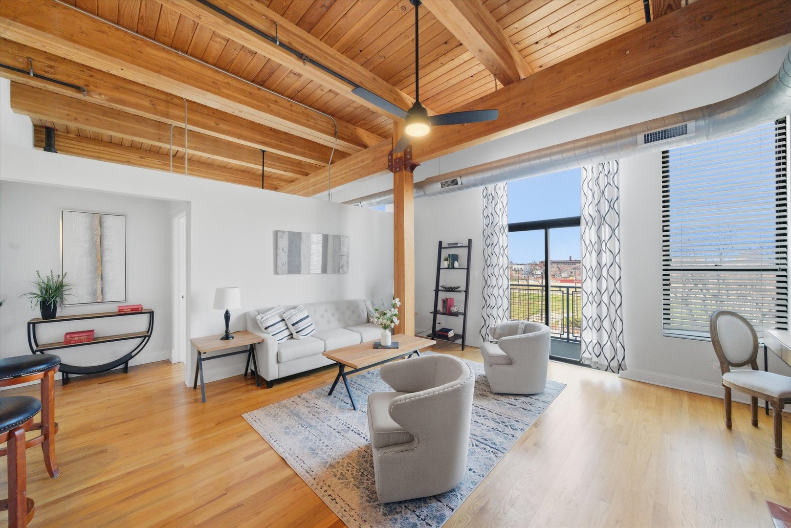 1610 South Halsted Street, Unit 401 Chicago, IL 60608 - Photo 3 of 31 a living room with fireplace furniture and a wooden floor
