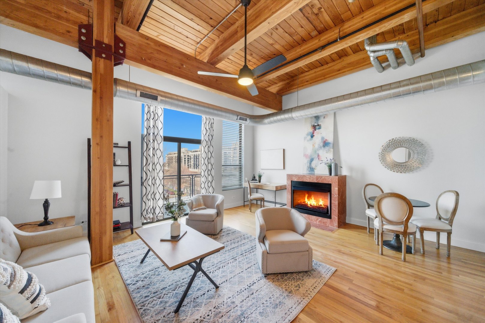 1610 South Halsted Street, Unit 401 Chicago, IL 60608 - Photo 4 of 31 a living room with furniture a fireplace and a table