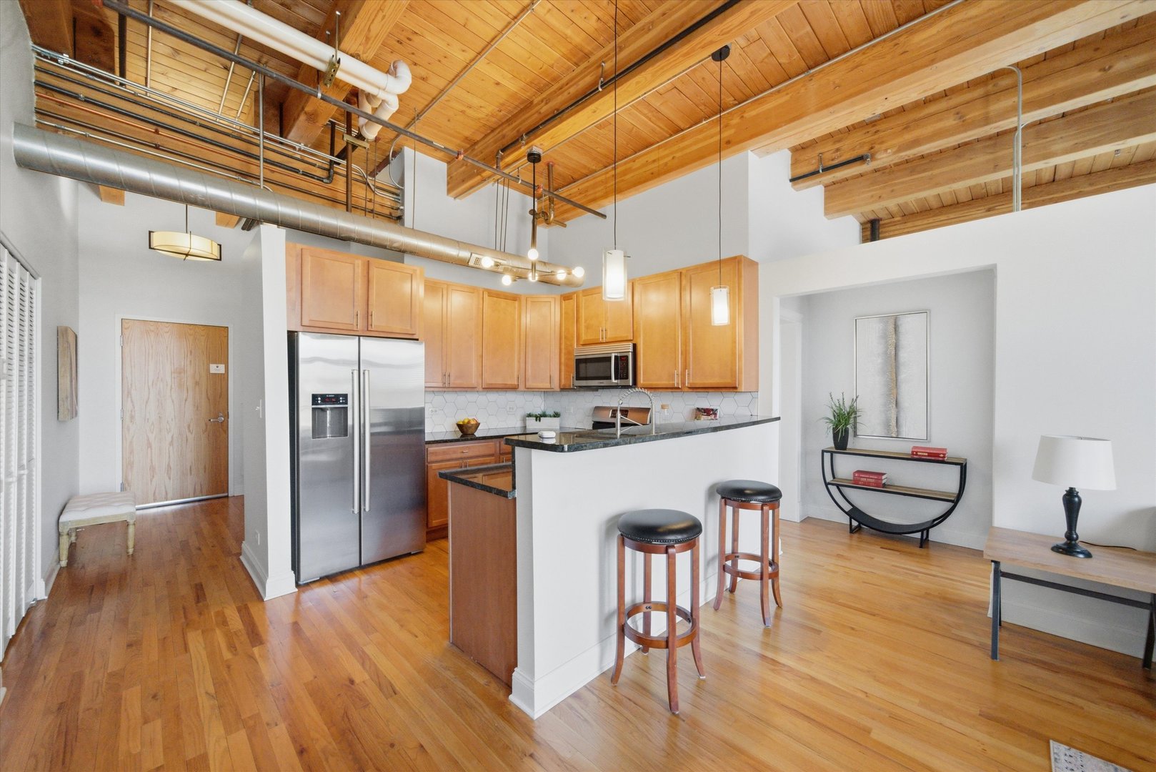 1610 South Halsted Street, Unit 401 Chicago, IL 60608 - Photo 6 of 31 a kitchen with a refrigerator a sink and a stove