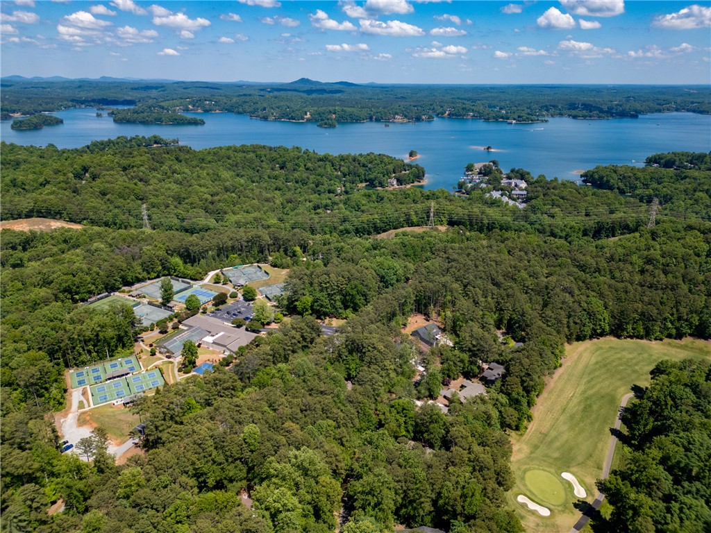 23 Tradewinds Way Salem, SC 29676 - Photo 14 of 31 An aerial perspective showcases a lush landscape featuring a lake, extensive tennis courts, and a golf course.