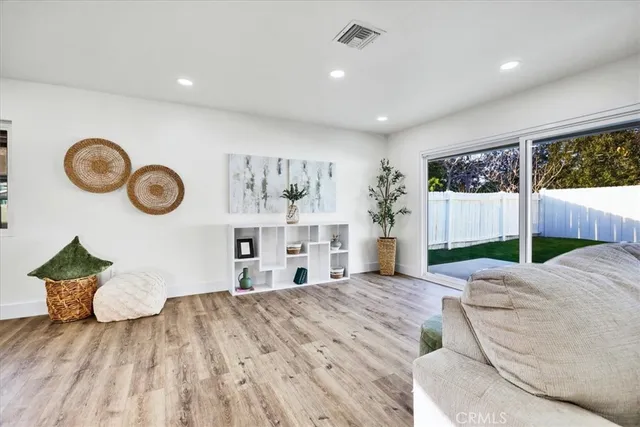 a spacious bedroom with a bed and a large window